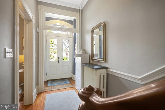 foyer featuring french doors and light wood finished floors