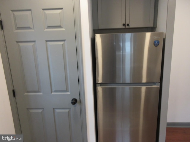 kitchen featuring gray cabinetry and stainless steel refrigerator