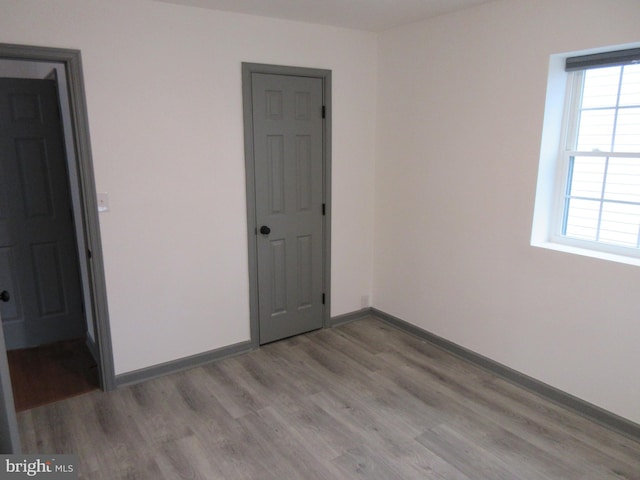 empty room with light wood-type flooring