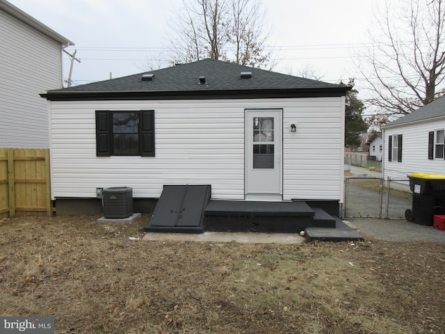 rear view of house with cooling unit