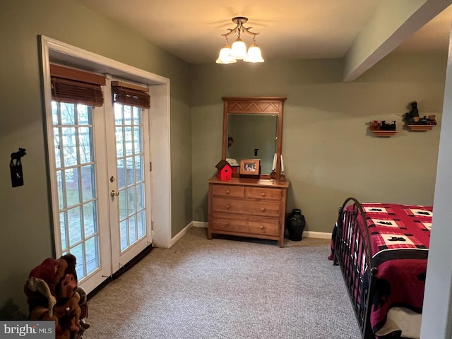 bedroom featuring french doors, an inviting chandelier, carpet flooring, access to outside, and baseboards