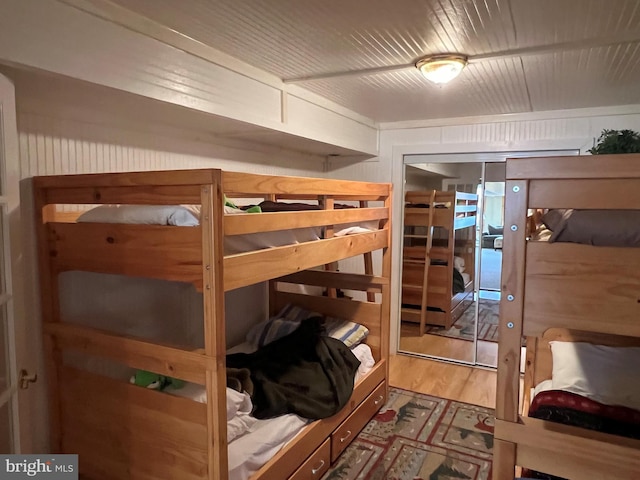 bedroom with a closet and wood finished floors