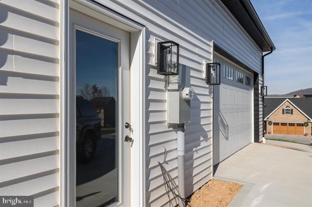 entrance to property featuring a garage