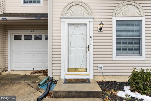 property entrance featuring a garage