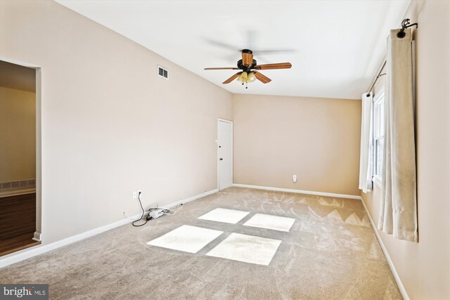 carpeted empty room with ceiling fan