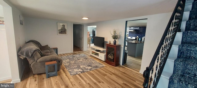 living room with light hardwood / wood-style flooring