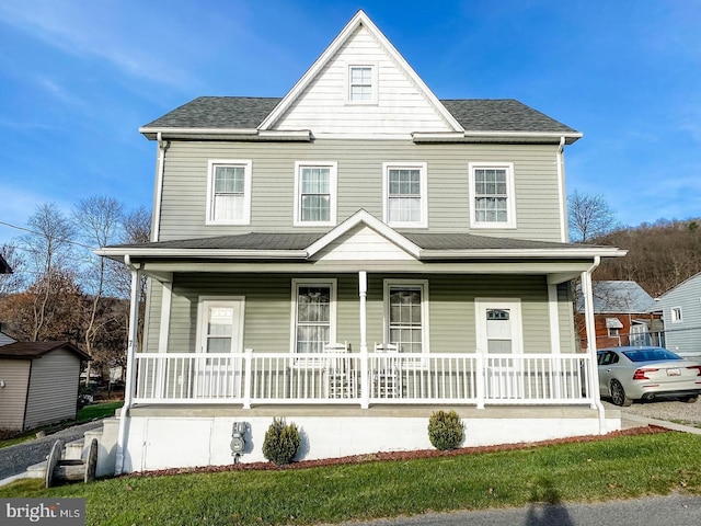 view of property featuring a porch