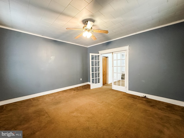 spare room featuring french doors, ceiling fan, ornamental molding, and carpet