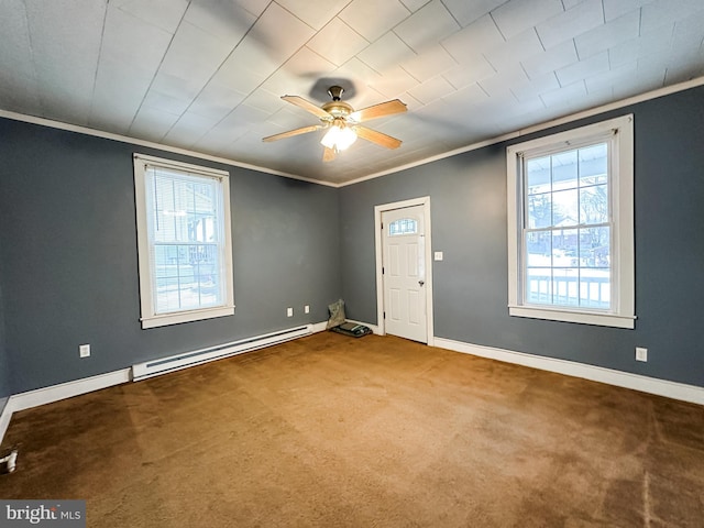 carpeted foyer featuring crown molding and ceiling fan