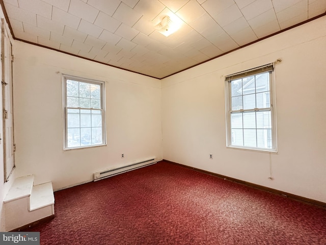 unfurnished room with ornamental molding, carpet, and baseboard heating