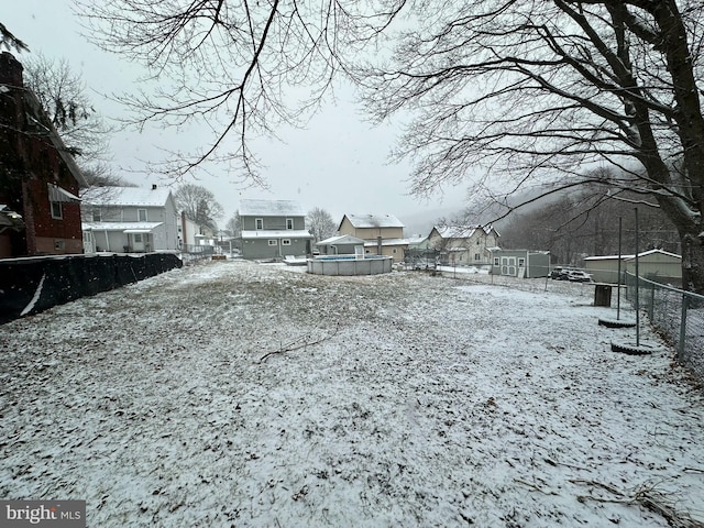 view of yard covered in snow