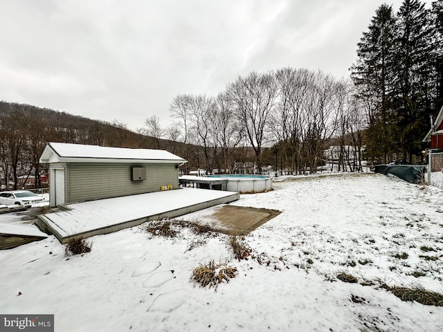 view of yard covered in snow