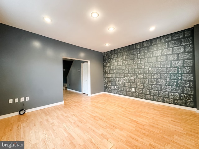 spare room featuring light hardwood / wood-style floors