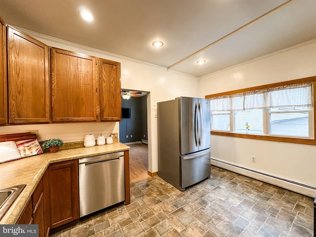 kitchen with a baseboard heating unit, sink, and appliances with stainless steel finishes