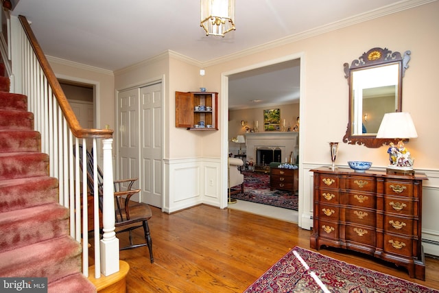 interior space featuring wood-type flooring and crown molding