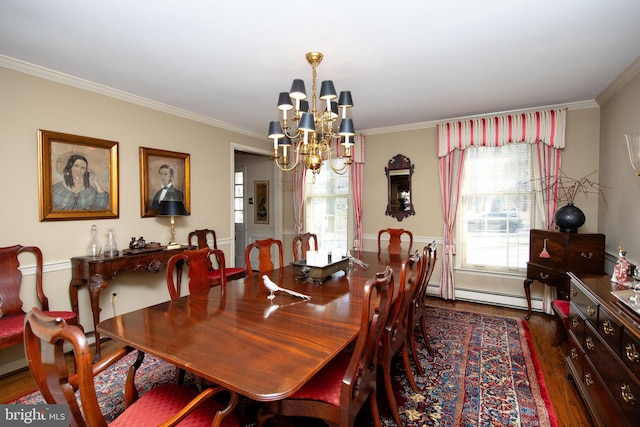 dining area with a baseboard radiator, dark wood-type flooring, crown molding, and a chandelier