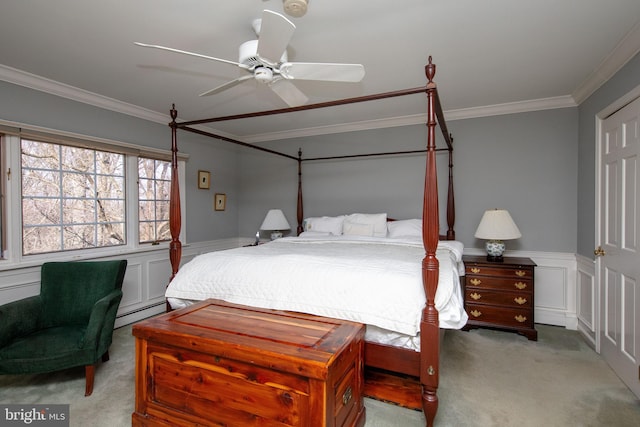 bedroom with crown molding, ceiling fan, baseboard heating, and light carpet