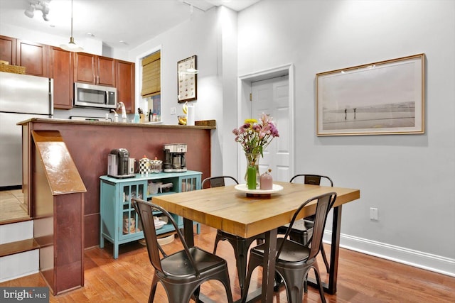 dining space featuring light hardwood / wood-style floors