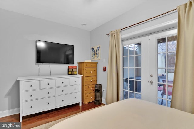 bedroom featuring dark hardwood / wood-style floors and french doors