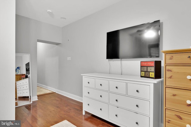 bedroom with wood-type flooring