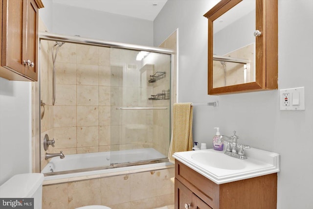 bathroom featuring vanity and enclosed tub / shower combo