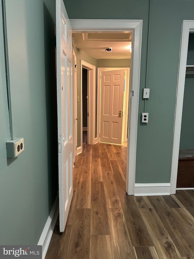 hall with dark hardwood / wood-style flooring