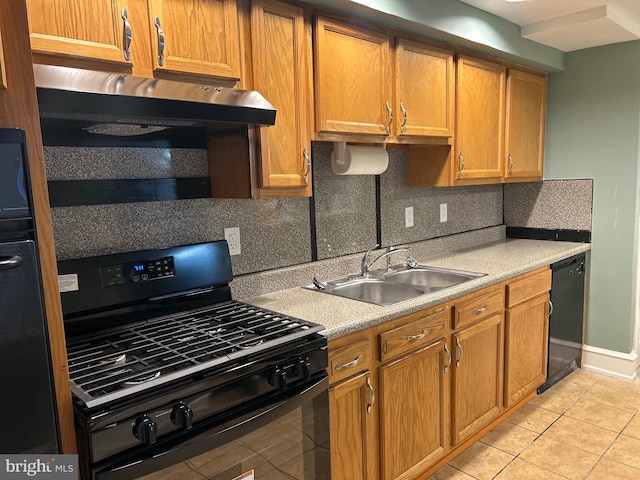 kitchen with sink, backsplash, black appliances, and light tile patterned floors