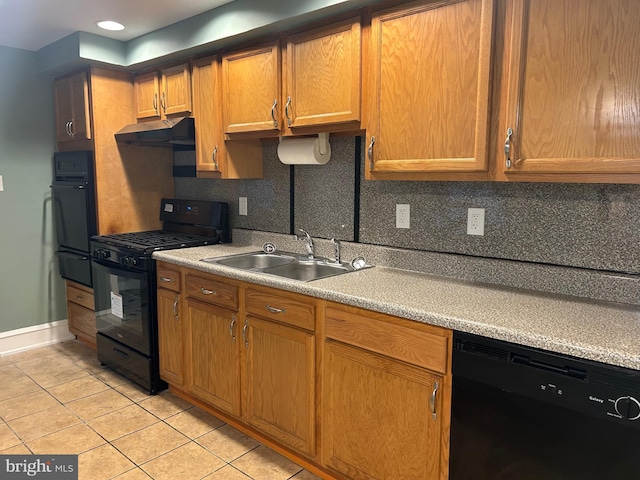 kitchen featuring sink, light tile patterned floors, backsplash, and black appliances