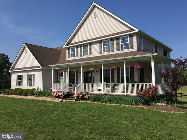 view of front facade with a porch and a front yard