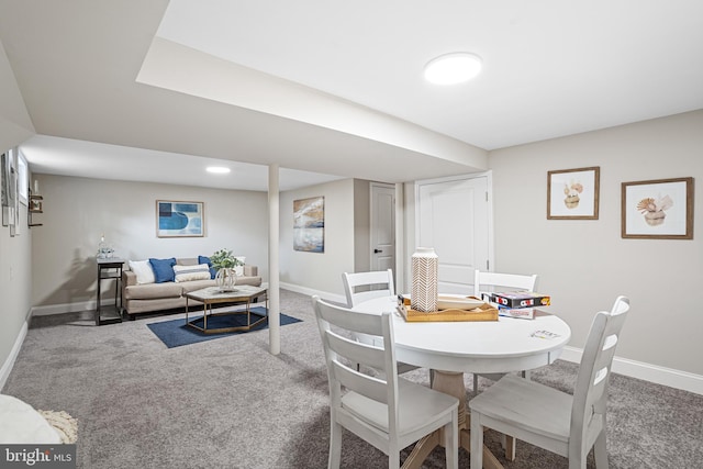 dining space featuring carpet flooring