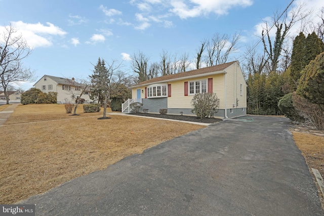 view of front of home with a front yard