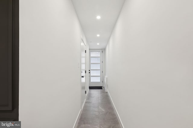 hall featuring concrete floors