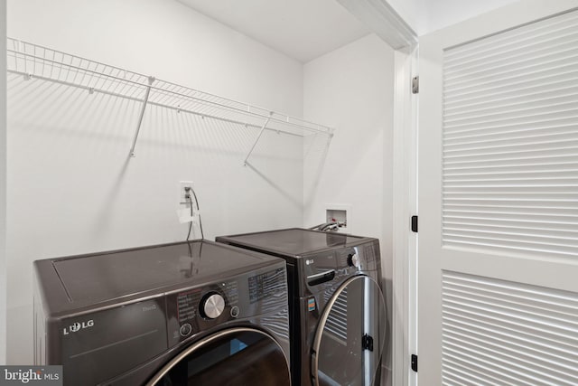 laundry room with washer and dryer