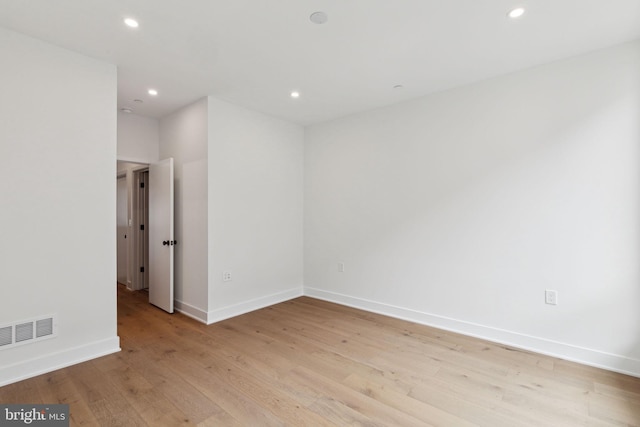 unfurnished room featuring light hardwood / wood-style flooring