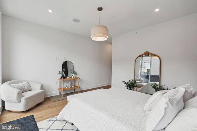 bedroom with light hardwood / wood-style floors