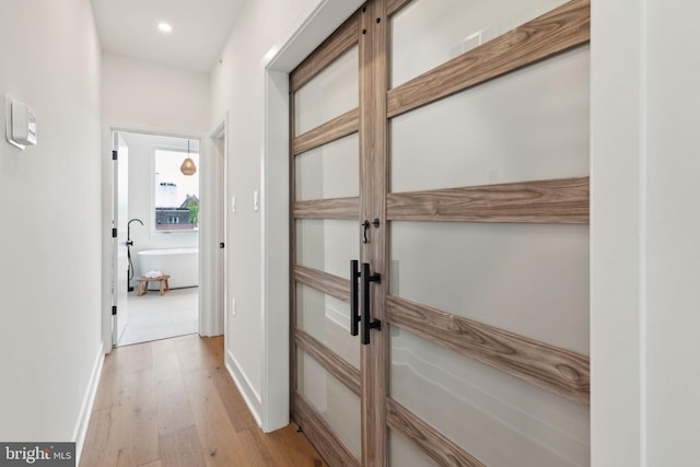 hallway featuring light hardwood / wood-style flooring