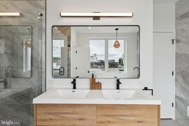 bathroom featuring walk in shower and vanity