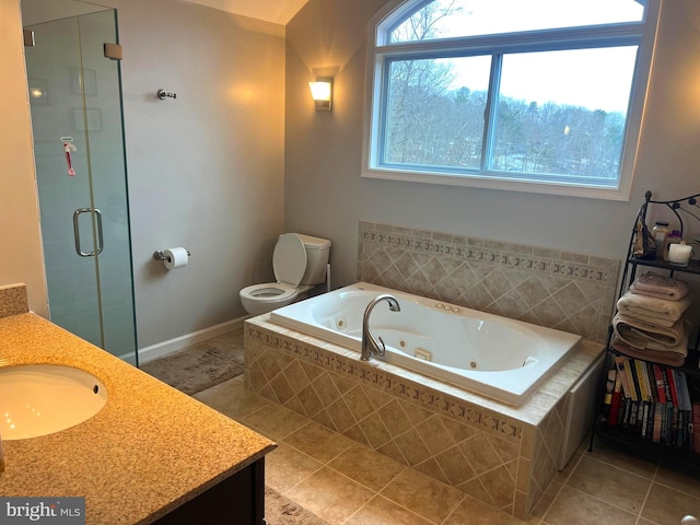 full bathroom featuring tile patterned floors, independent shower and bath, vanity, and toilet