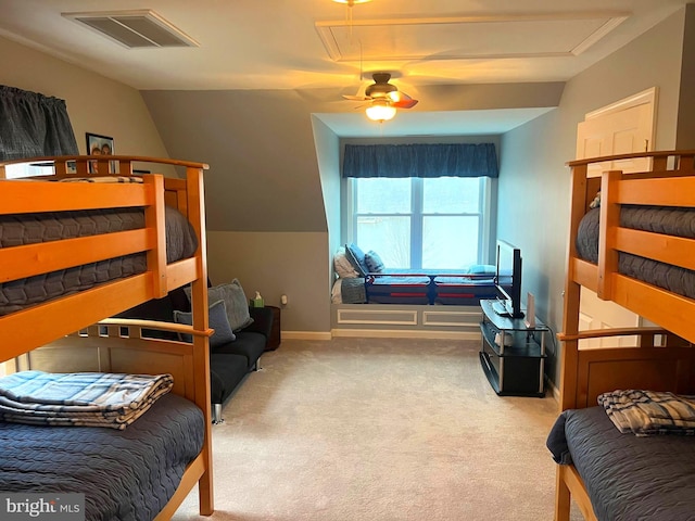 carpeted bedroom featuring vaulted ceiling and ceiling fan