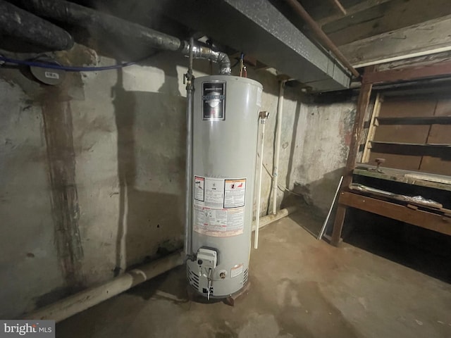 utility room featuring water heater