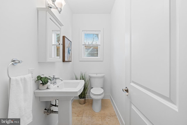 bathroom with tile patterned floors and toilet