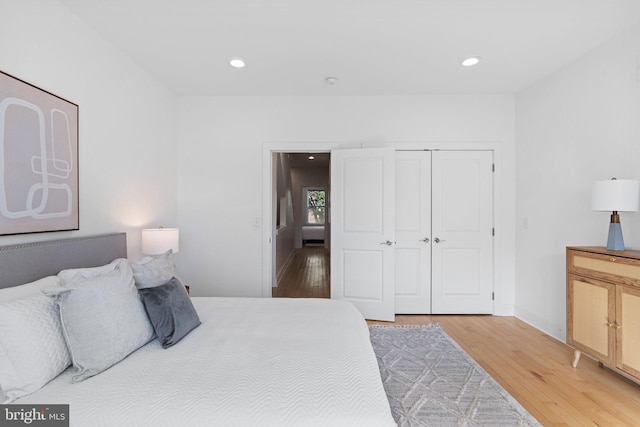 bedroom featuring wood-type flooring and a closet