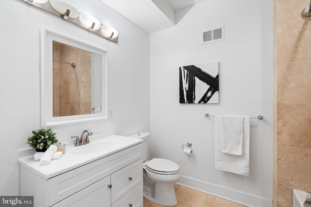 bathroom with vanity, walk in shower, tile patterned floors, and toilet