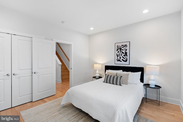 bedroom with a closet and light wood-type flooring