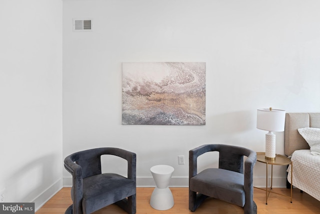 sitting room featuring hardwood / wood-style flooring