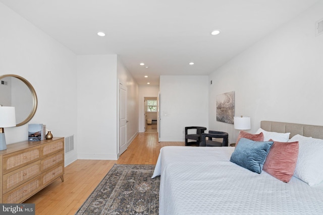 bedroom with light hardwood / wood-style flooring