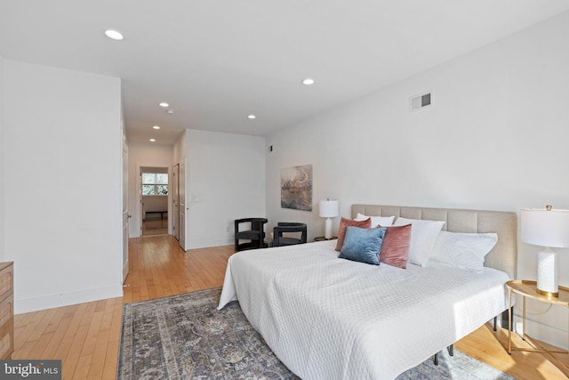 bedroom with wood-type flooring