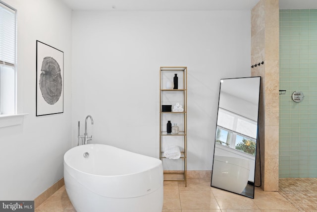 bathroom featuring plus walk in shower and tile patterned flooring