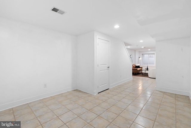 empty room with light tile patterned floors