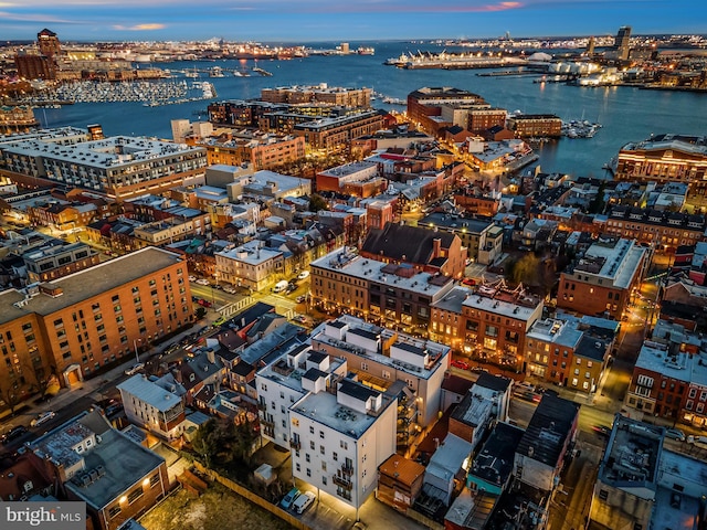 aerial view at dusk with a water view